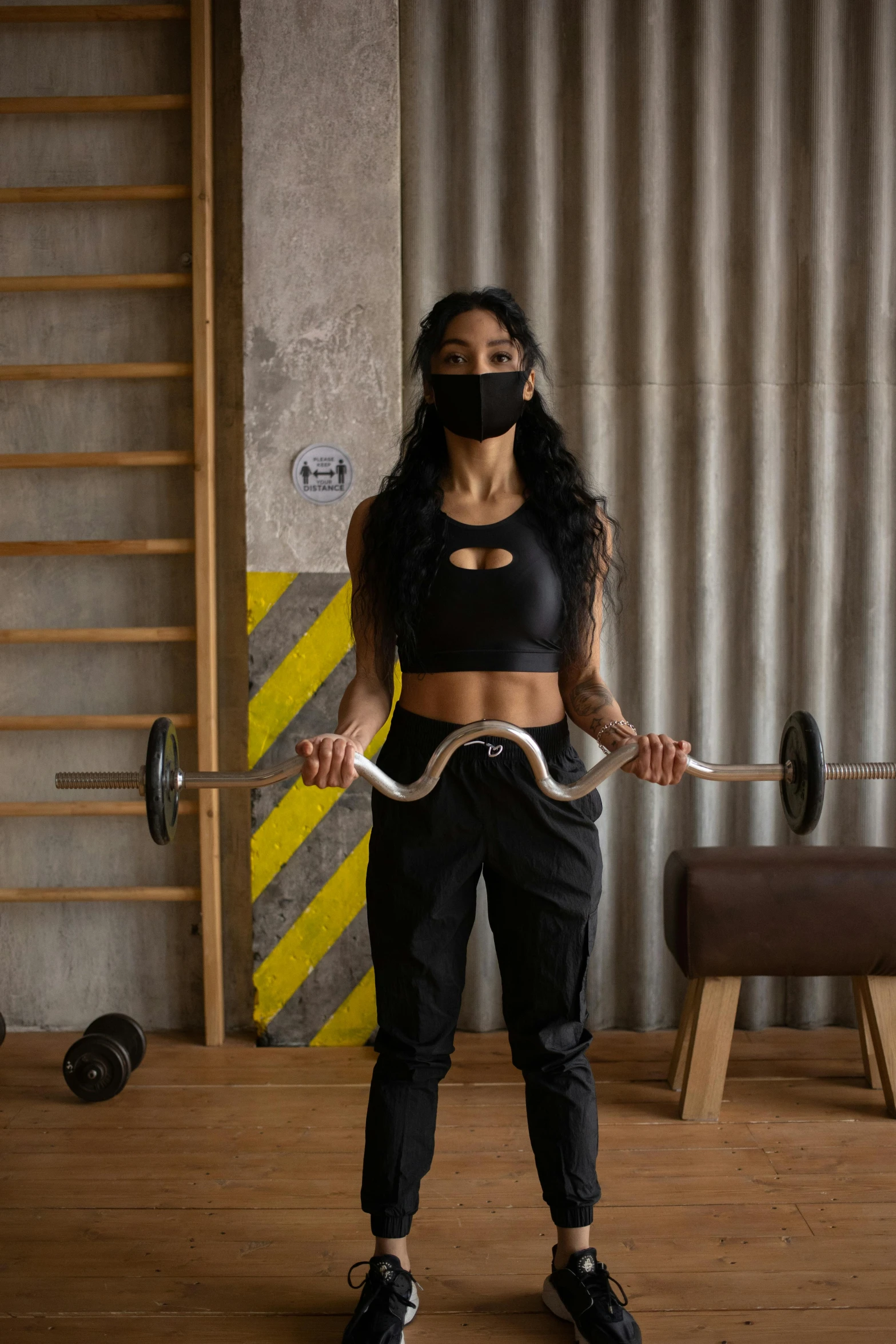 a woman in a black top holding a snake, by Natasha Tan, carrying two barbells, wearing mask, kyza saleem, neoprene