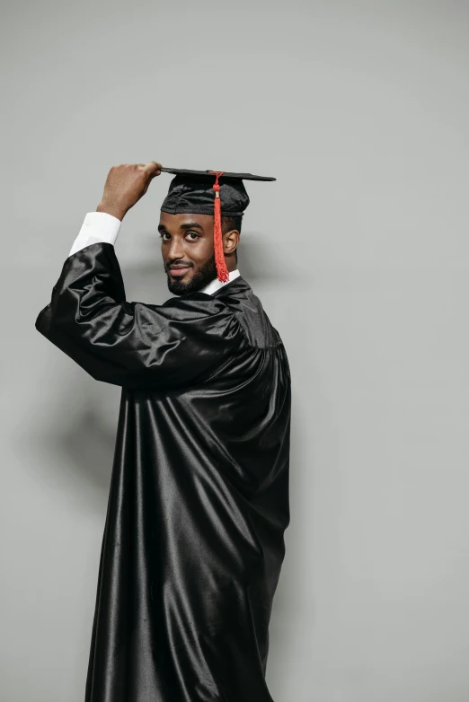 a man in a graduation cap and gown, pexels, handsome hip hop young black man, jaylen brown, an intricate, gray men