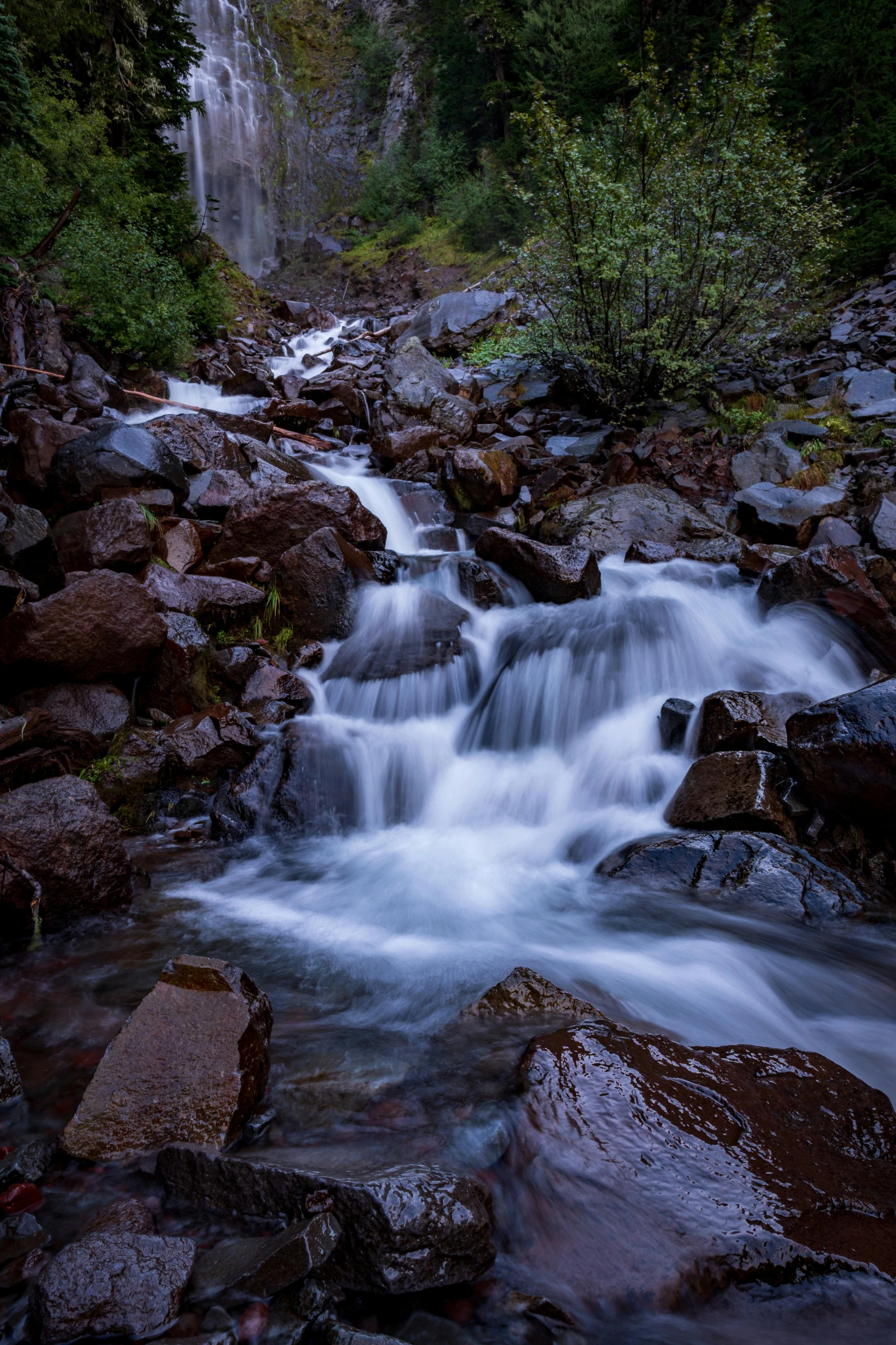 a waterfall flowing through a lush green forest, by Paul Emmert, unsplash contest winner, colorado, late summer evening, 2 5 6 x 2 5 6 pixels, wet rocks