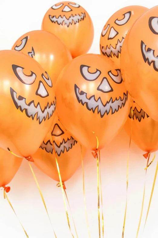 a bunch of orange balloons with faces on them, spooky halloween theme, profile image, no - text no - logo, smiling