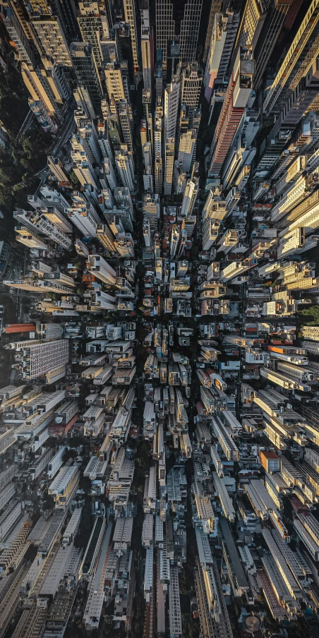 an aerial view of a city with tall buildings, by Dan Christensen, unsplash contest winner, conceptual art, 8 k detailed photograph, perspective from below, an overpopulated, hong kong