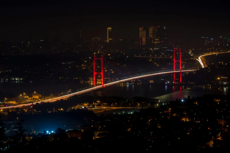 the golden gate bridge is lit up at night, a picture, by Yasar Vurdem, hurufiyya, istanbul, 2022 photograph, slide show, landscape photo