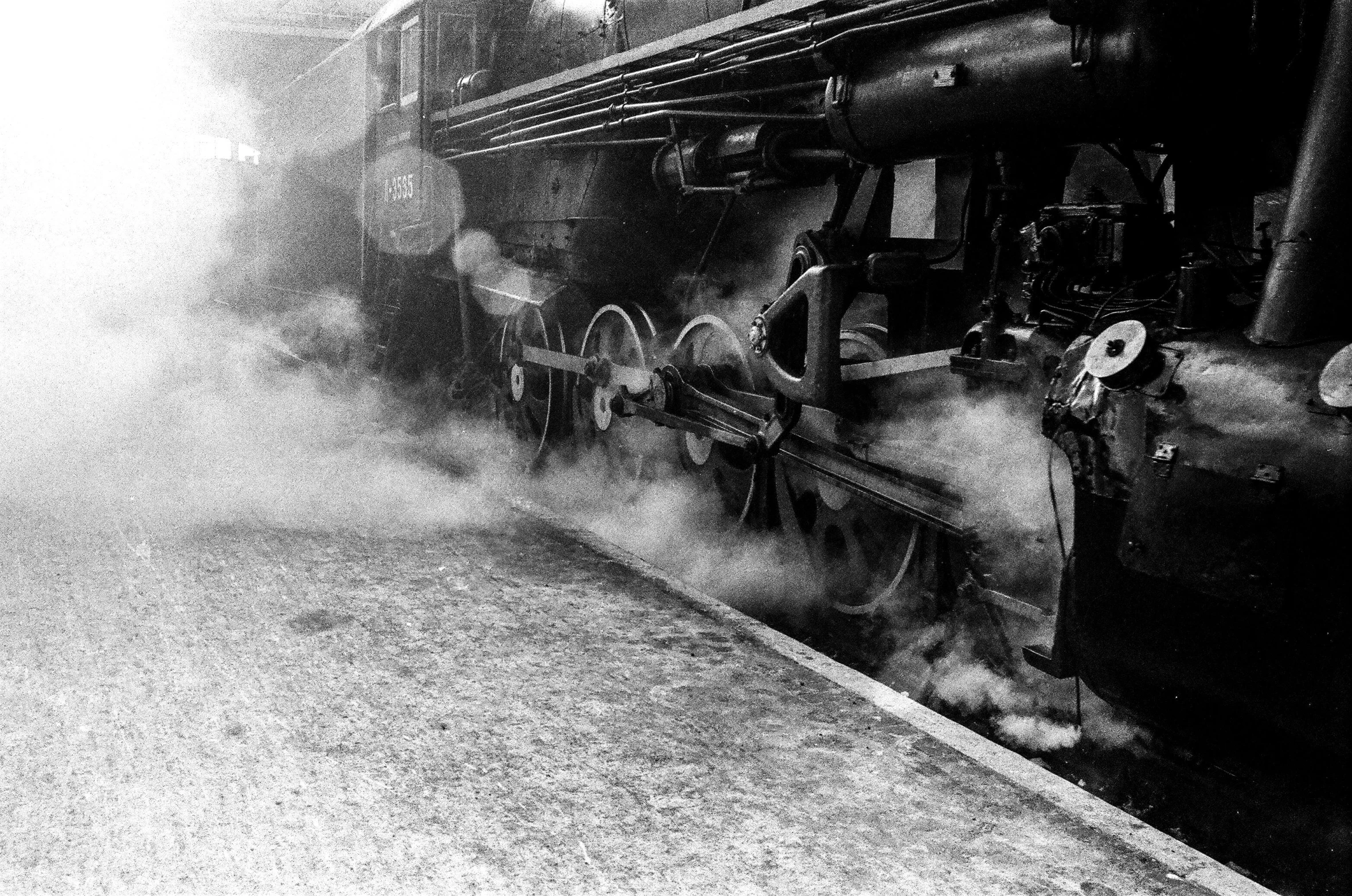 a black and white photo of a steam engine, by Peter Scott, fine art, round about to start, cheeks, morning detail, 1 9 6 2