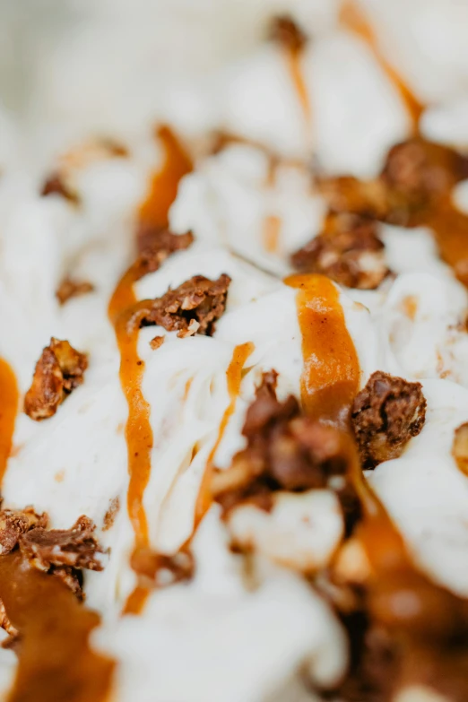 a close up of a dessert on a plate, ice cream, bowl filled with food