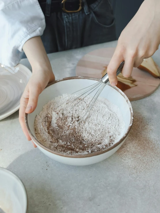 a person holding a whisk in a bowl, white with chocolate brown spots, thumbnail, japanese collection product, flour dust