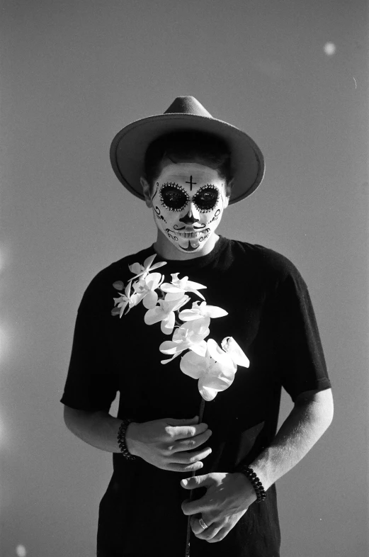 a black and white photo of a man in day of the dead makeup, a black and white photo, by Robert Mapplethorpe, reddit, yung lean, summertime, full body picture, flower face