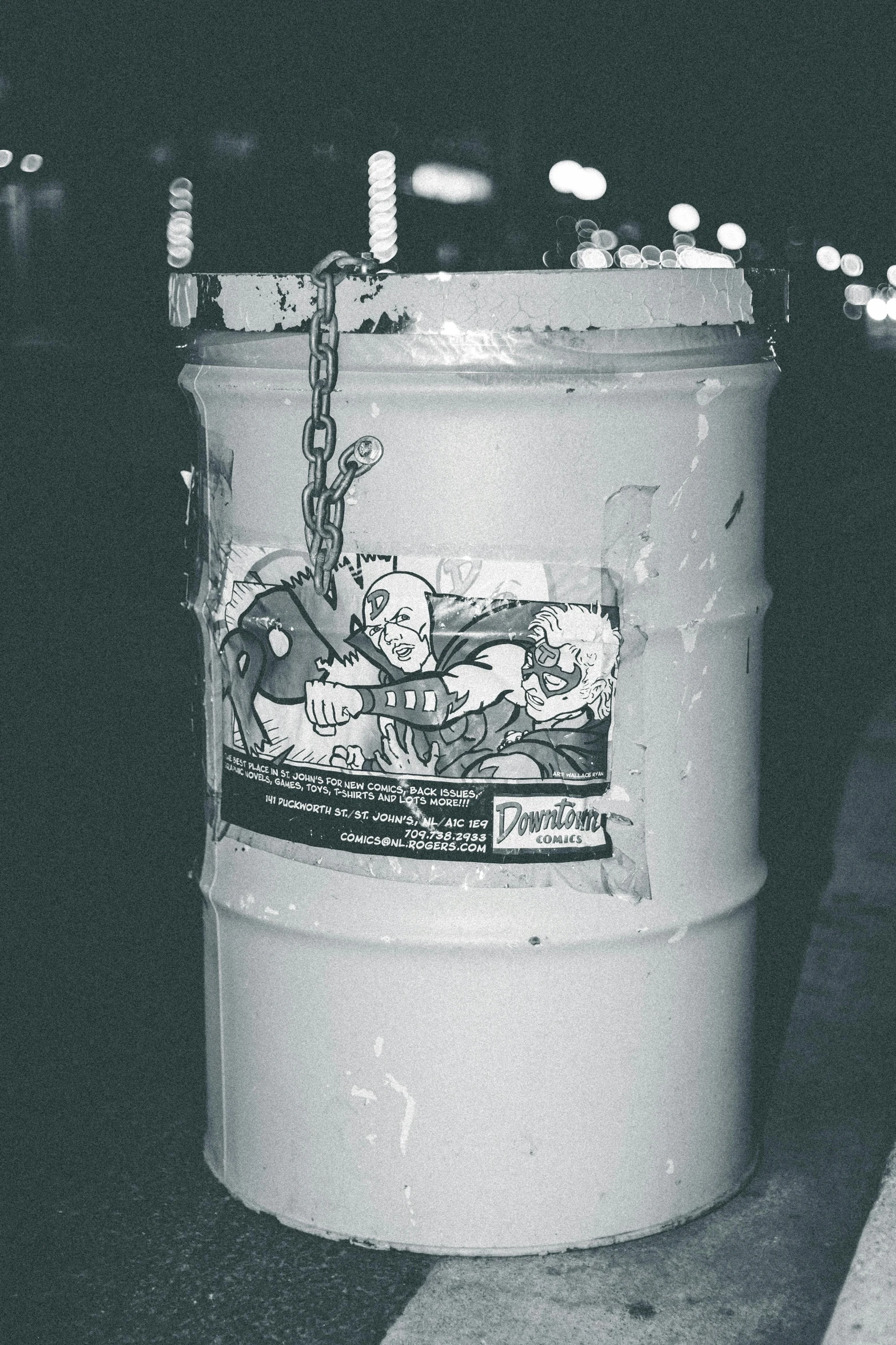 a white trash can sitting on the side of a road, a poster, unsplash, street art, ((chains)), gray scale, sticker design, punk party