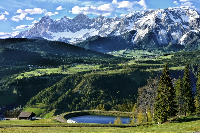 a view of a mountain range with a lake in the foreground, inspired by Jan Kupecký, pexels contest winner, overlooking a valley with trees, meadows, alpine architecture, avatar image