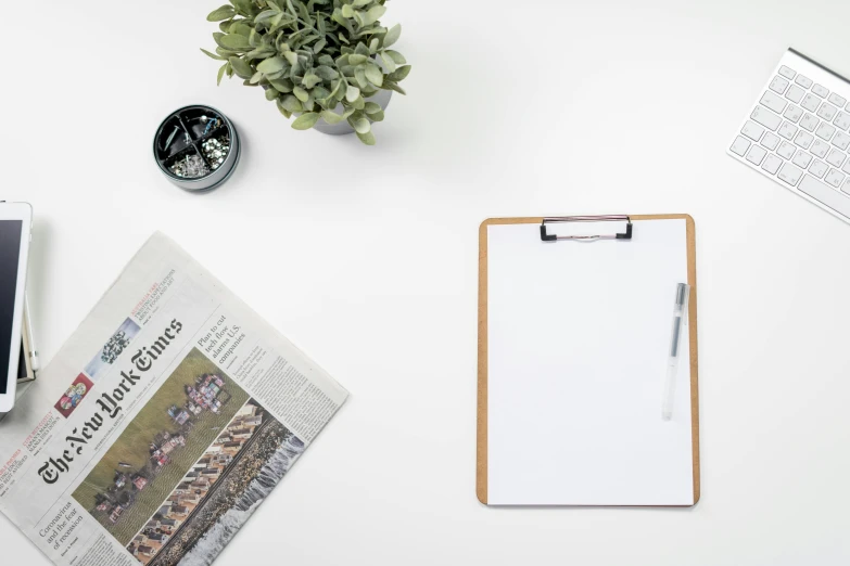 a tablet computer sitting on top of a desk next to a cup of coffee, pexels contest winner, visual art, clean white paper background, background image, botanical herbarium paper, clipboard