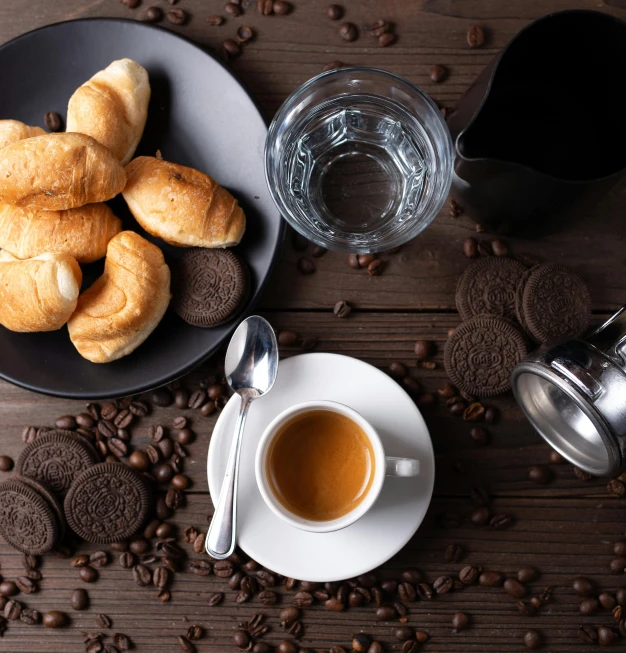 a plate of cookies next to a cup of coffee, a still life, by Lucia Peka, pexels contest winner, curving black, knolling, espresso machine, black