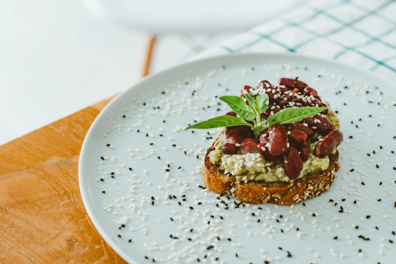 a close up of a plate of food on a table, unsplash, mingei, toast, background image, cherry, basil