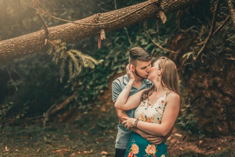a man kissing a woman in front of a tree, pexels contest winner, te pae, avatar image, 1 2 9 7, fan favorite