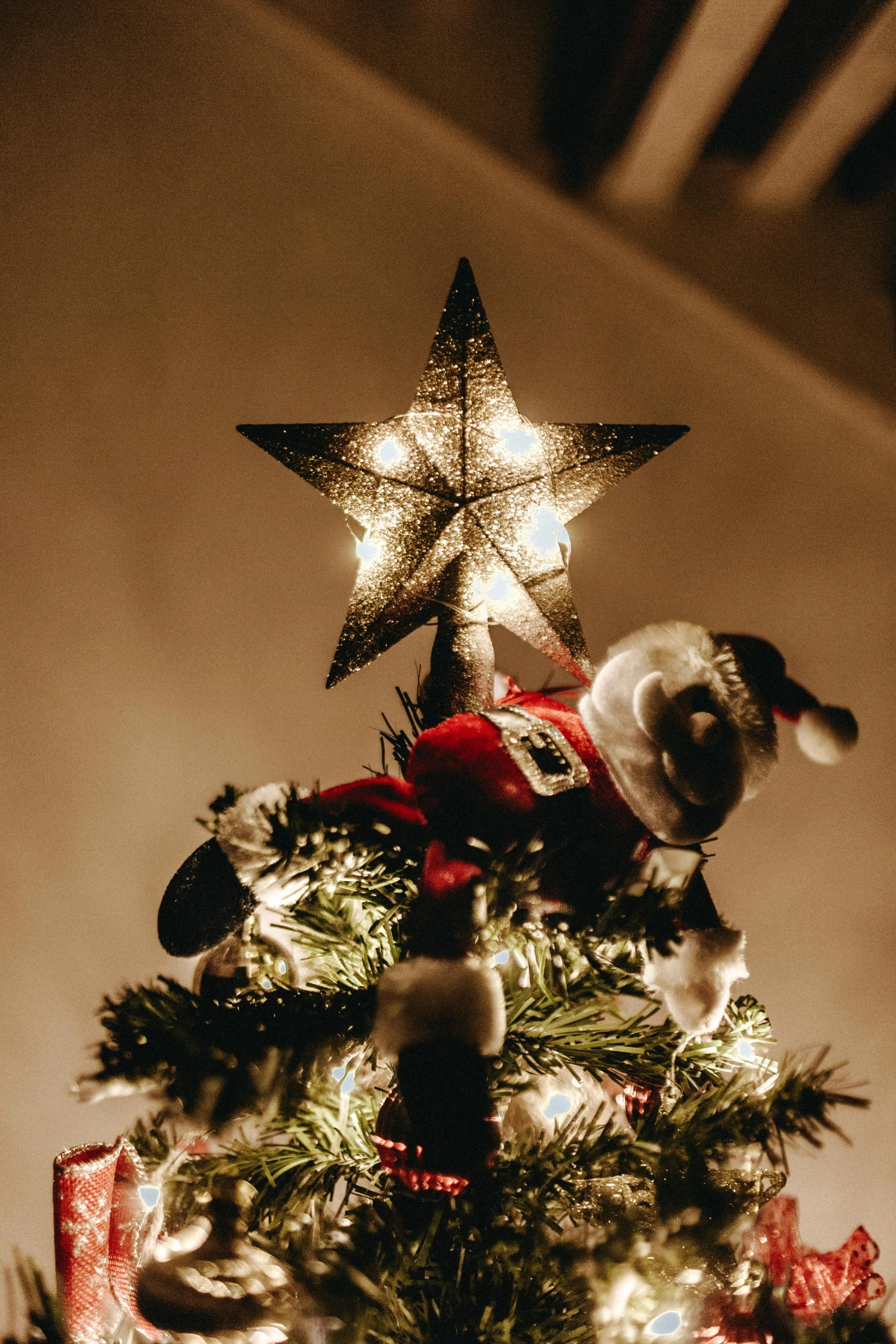 a dog sitting on top of a christmas tree, inspired by Ernest William Christmas, pexels, folk art, dynamic lighting stars, medium closeup, santa, glowing with silver light