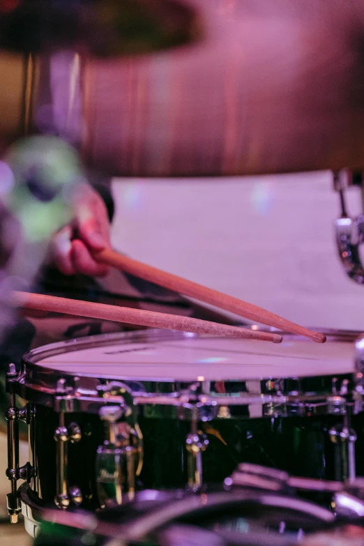 a close up of a person playing drums, an album cover, pexels contest winner, happening, performance, tamborine, bangles, levers