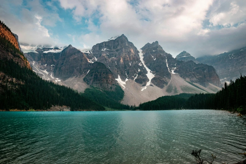 a large body of water with mountains in the background, by Austin English, pexels contest winner, hurufiyya, banff national park, conde nast traveler photo, craggy, hd footage