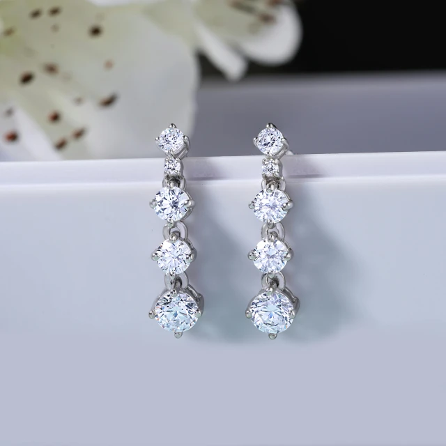 a pair of diamond earrings sitting on top of a white plate, by Emma Andijewska, trending on cg society, fan favorite, 8 k, five elegant fingers, multiple earrings