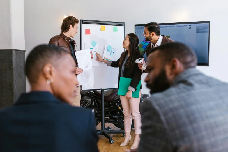 a group of people standing around a white board, pexels contest winner, innovation, varying ethnicities, in front of a computer, professional modeling