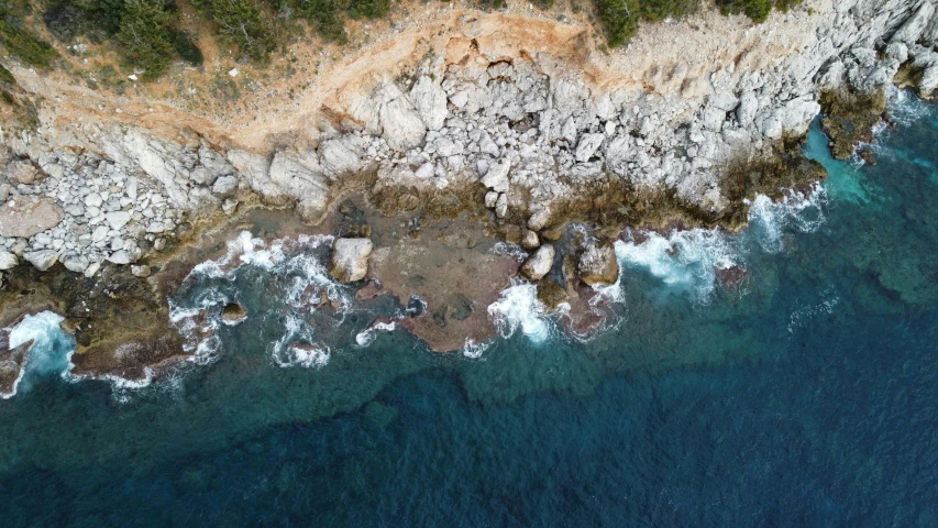a bird's eye view of a rocky coastline, pexels contest winner, les nabis, “ iron bark, split near the left, slide show, epic 3 d omolu