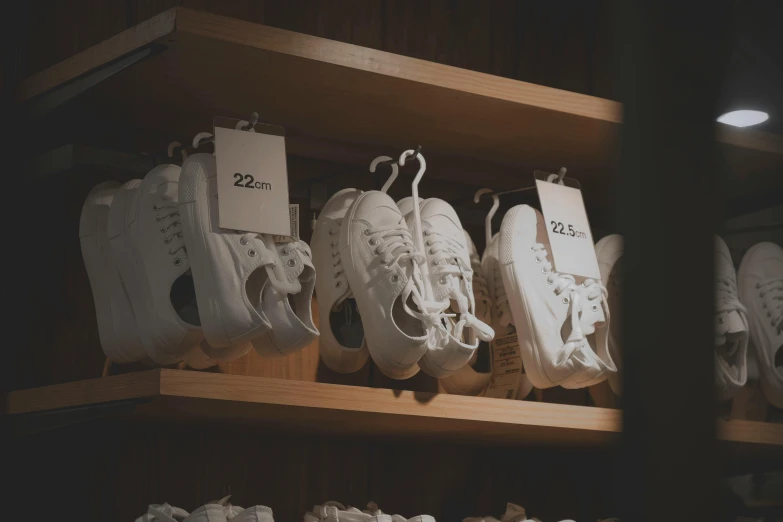 a bunch of shoes that are on a shelf, pexels contest winner, wearing white clothes, replicas, product display, children's