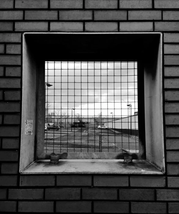 a black and white photo of a window in a brick wall, outside in parking lot, square lines, stood in a cell, ash thorp