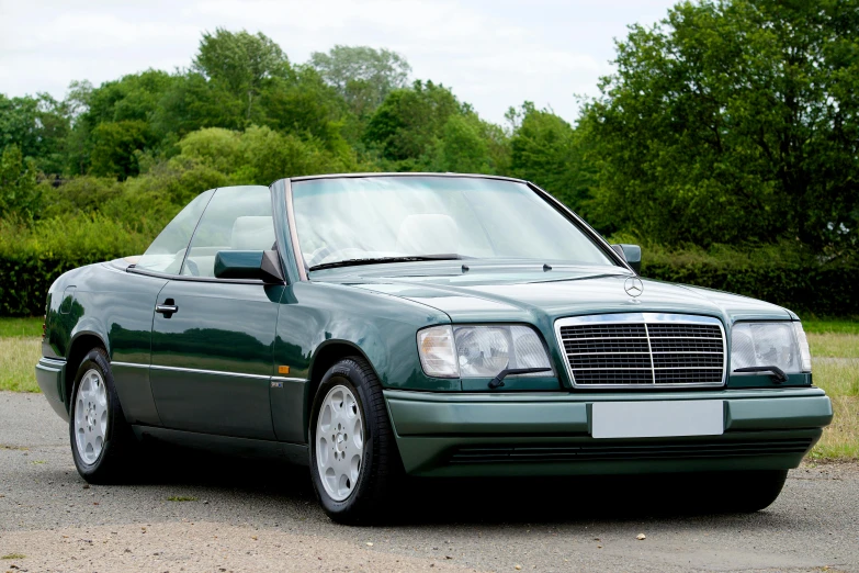 a green mercedes benz benz benz benz benz benz benz benz benz benz benz benz benz benz benz, by Joseph Severn, pexels contest winner, taken in the early 1990s, open top, esher, medium wide front shot