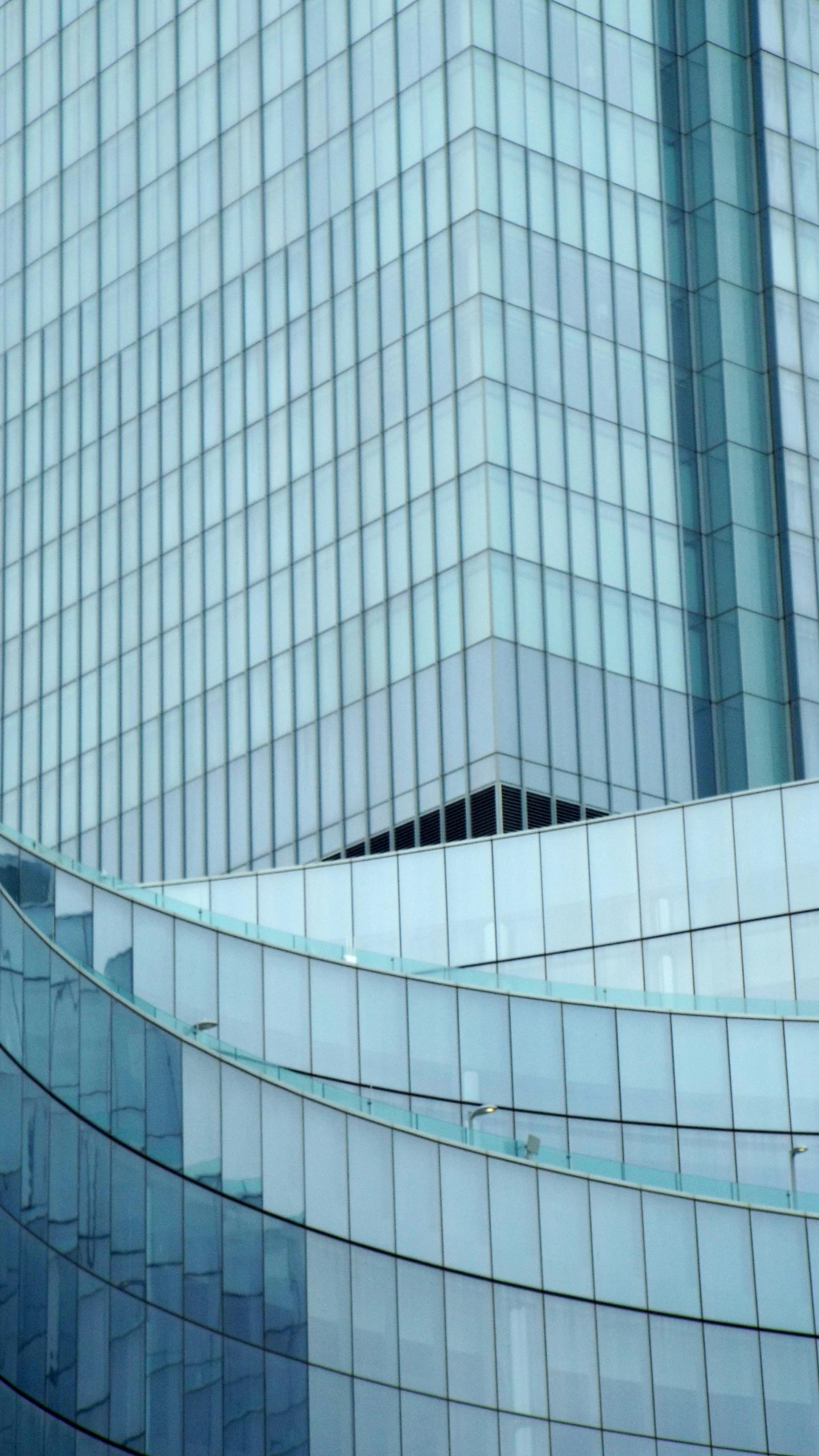 a clock that is on a pole in front of a building, inspired by Zaha Hadid, modernism, stock photograph, glass texture, white and pale blue toned, highrise made up staircases