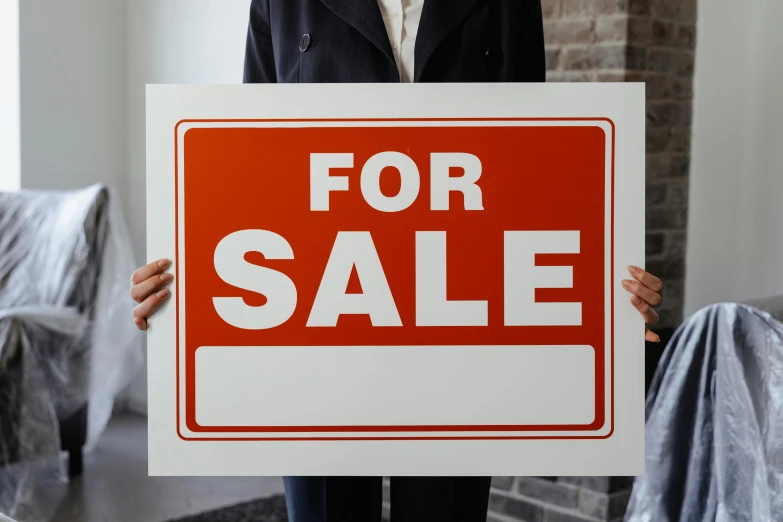 a woman holding up a for sale sign, a poster, unsplash, bauhaus, highly realistic photo realistic, square, colour print, no - text no - logo