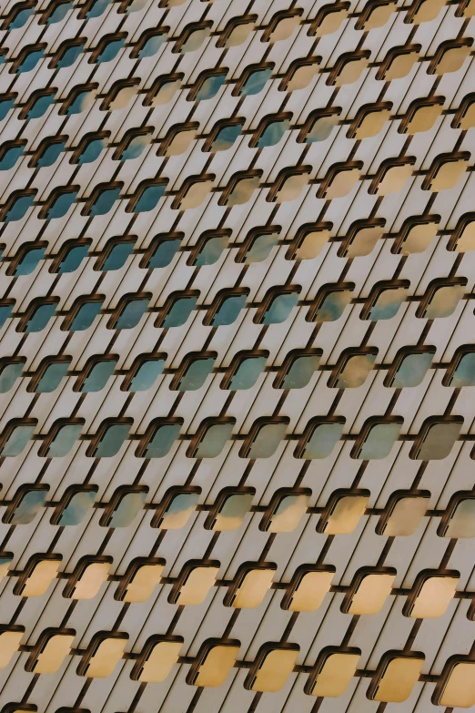 a very tall building with a lot of windows, an album cover, by Sven Erixson, unsplash, brutalism, abstract pattern, zoomed in shots, brown holes, square