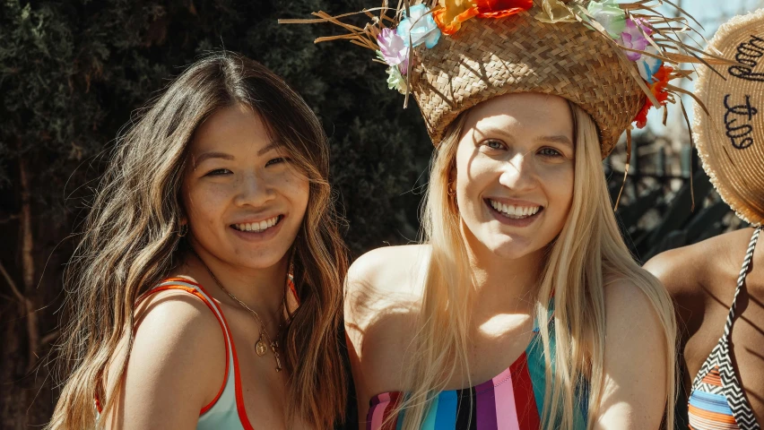 a group of young women standing next to each other, a portrait, unsplash, wearing sombrero, one blonde and one brunette, tyler edlin and natasha tan, wearing a headband