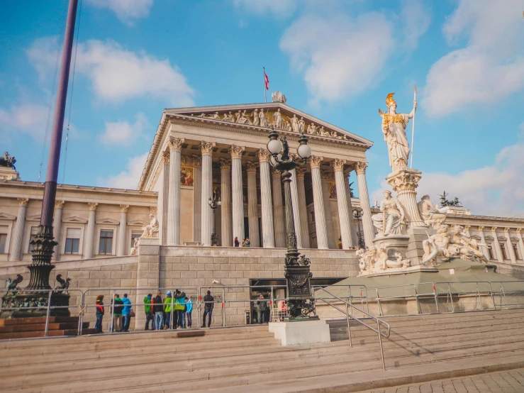 a group of people standing in front of a building, a marble sculpture, by Sebastian Spreng, pexels contest winner, viennese actionism, parliament, promo image, brown, square