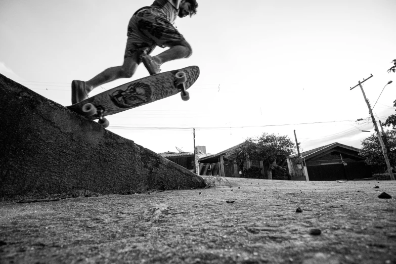 a man flying through the air while riding a skateboard, a black and white photo, by Xavier Blum Pinto, pexels contest winner, realism, cement, low quality footage, action shots, rusty