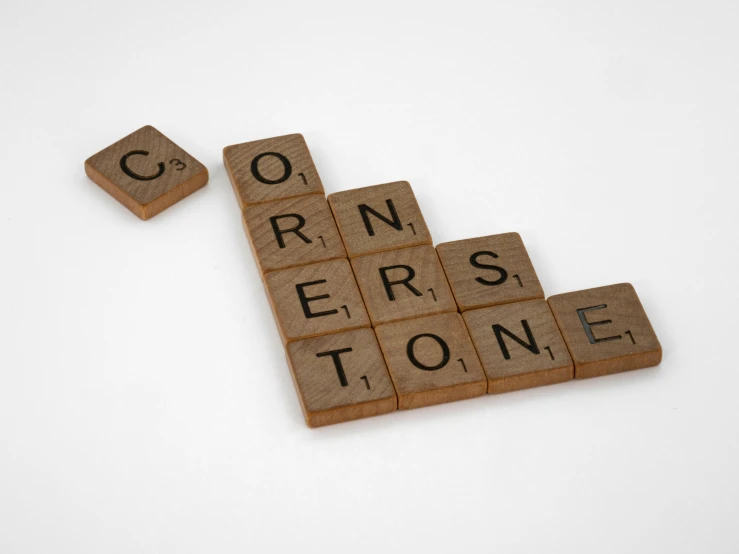 wooden scrabbles spelling corn, peppers, and tone on a white surface, unsplash contest winner, constructivism, stone brick, convertable, sunstone, commission