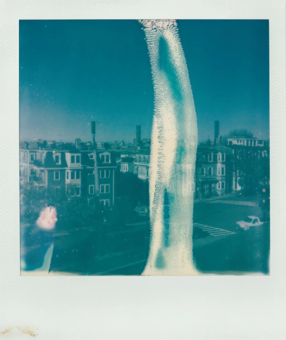 an airplane flying in the sky over a city, a polaroid photo, by Christopher Williams, conceptual art, icicle, translucent sss xray, ( ( photograph ) ), mermaids in distance