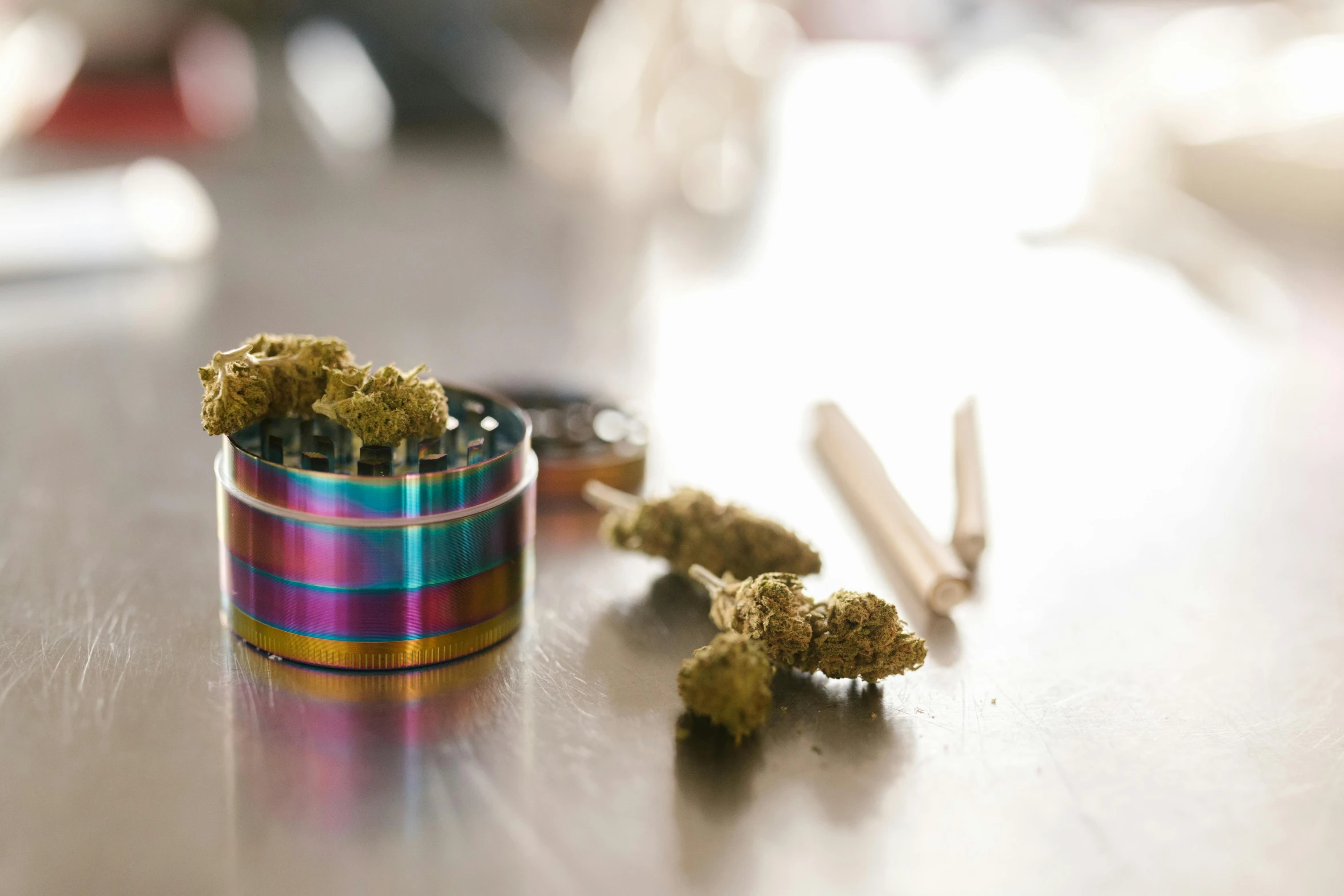 a couple of marijuana buds sitting on top of a table, trending on pexels, metal lid, multi - coloured, pestle, various items