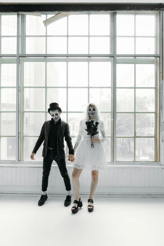 a couple of people that are standing in front of a window, unsplash, international gothic, ska skeleton and girlfriend, in white room, wedding, mime