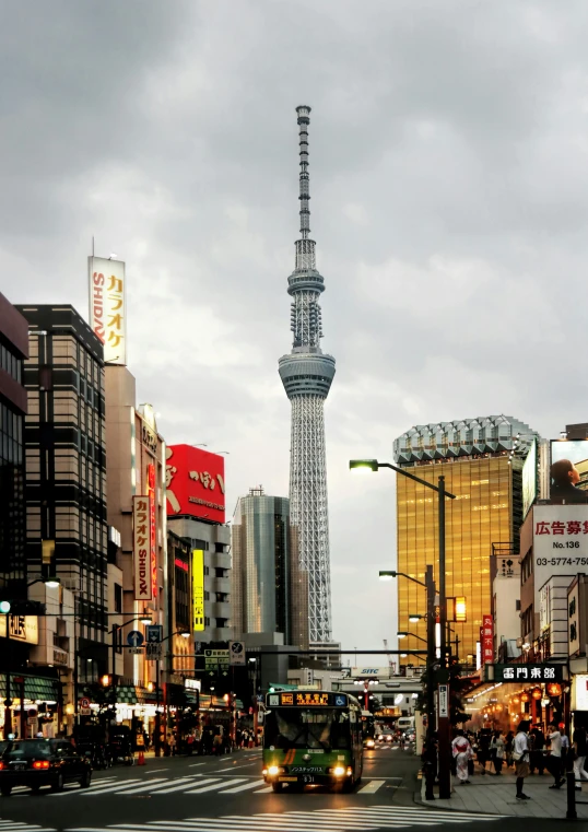 a city street filled with lots of traffic and tall buildings, a picture, sōsaku hanga, japan tokyo skytree, akihiko yoshida”