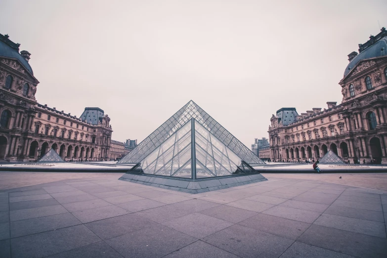 a large glass pyramid sitting in the middle of a courtyard, a marble sculpture, by Adam Rex, unsplash contest winner, french architecture, monalisa, square lines, distant photo