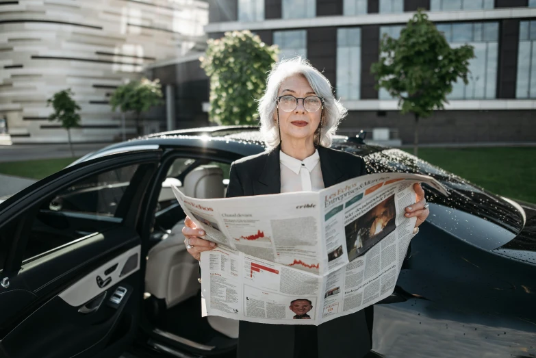 a woman standing in front of a car reading a newspaper, pexels contest winner, private press, white-haired, avatar image, corporate photo, ekaterina