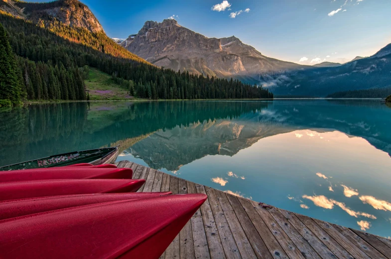 a group of canoes sitting on top of a wooden dock, by Erik Pevernagie, pexels contest winner, mountain lakes, avatar image