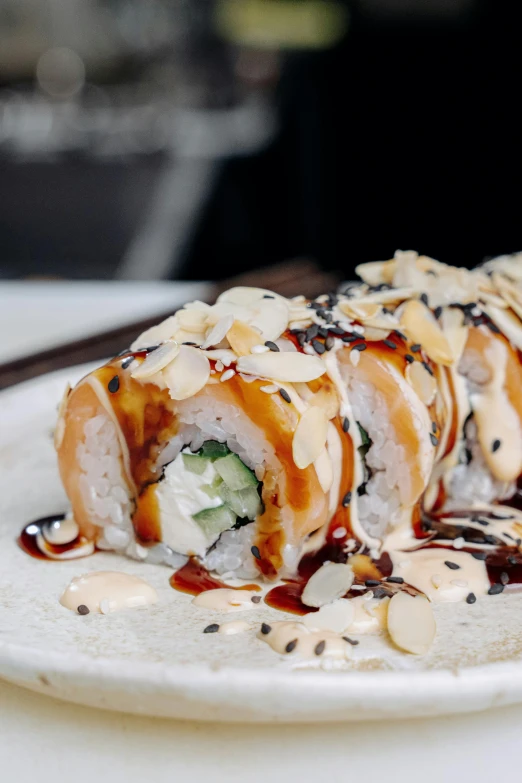 a close up of a plate of food on a table, inspired by Maki Haku, unsplash, caramel, stuffed, sub tropical, white