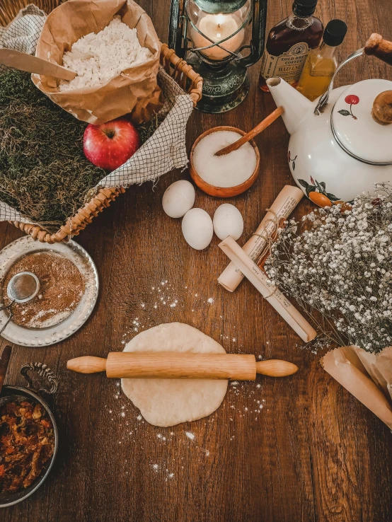 a table topped with lots of food on top of a wooden table, covered in white flour, thumbnail, cottagecore, tools