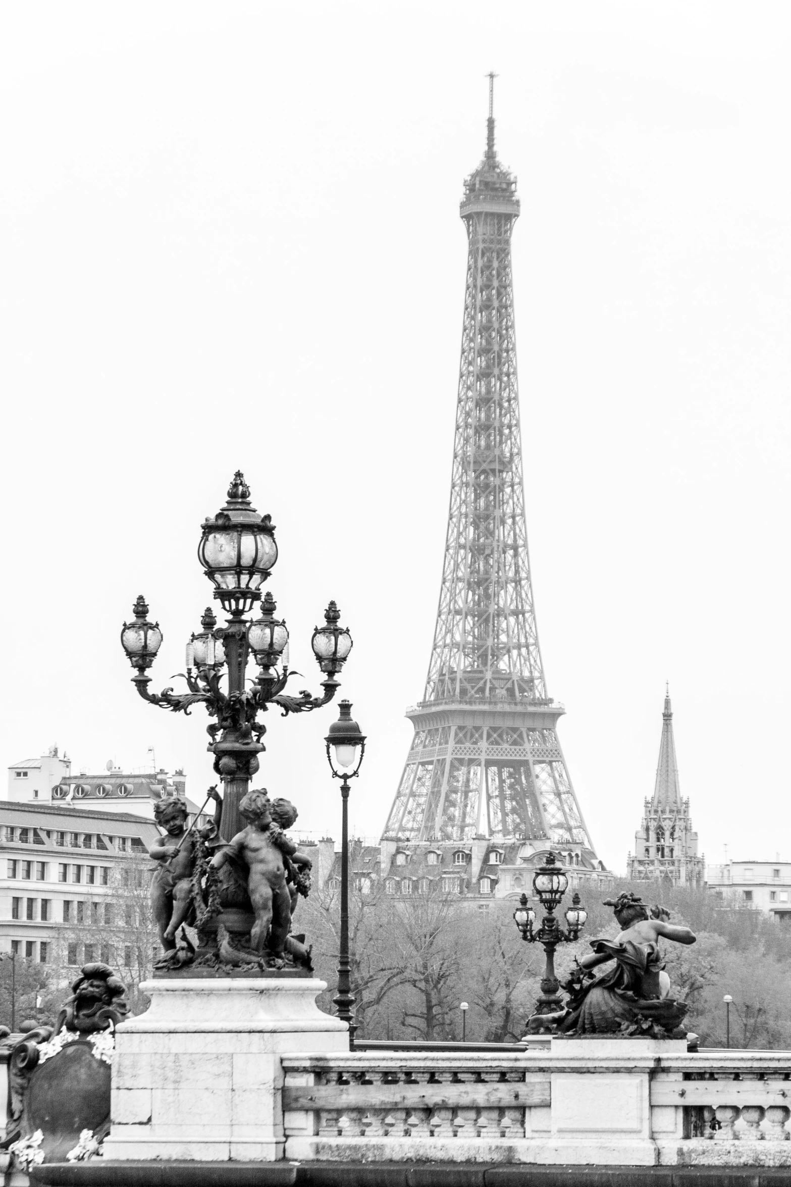 a black and white photo of the eiffel tower, visual art, bronze statue and silver, ( ( photograph ) ), lampposts, in 2 0 1 5