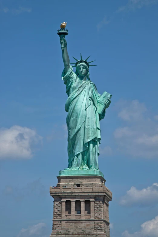 the statue of liberty stands tall in the sky, flickr, made of bronze, full body frontal view, july 2 0 1 1, f/3.2