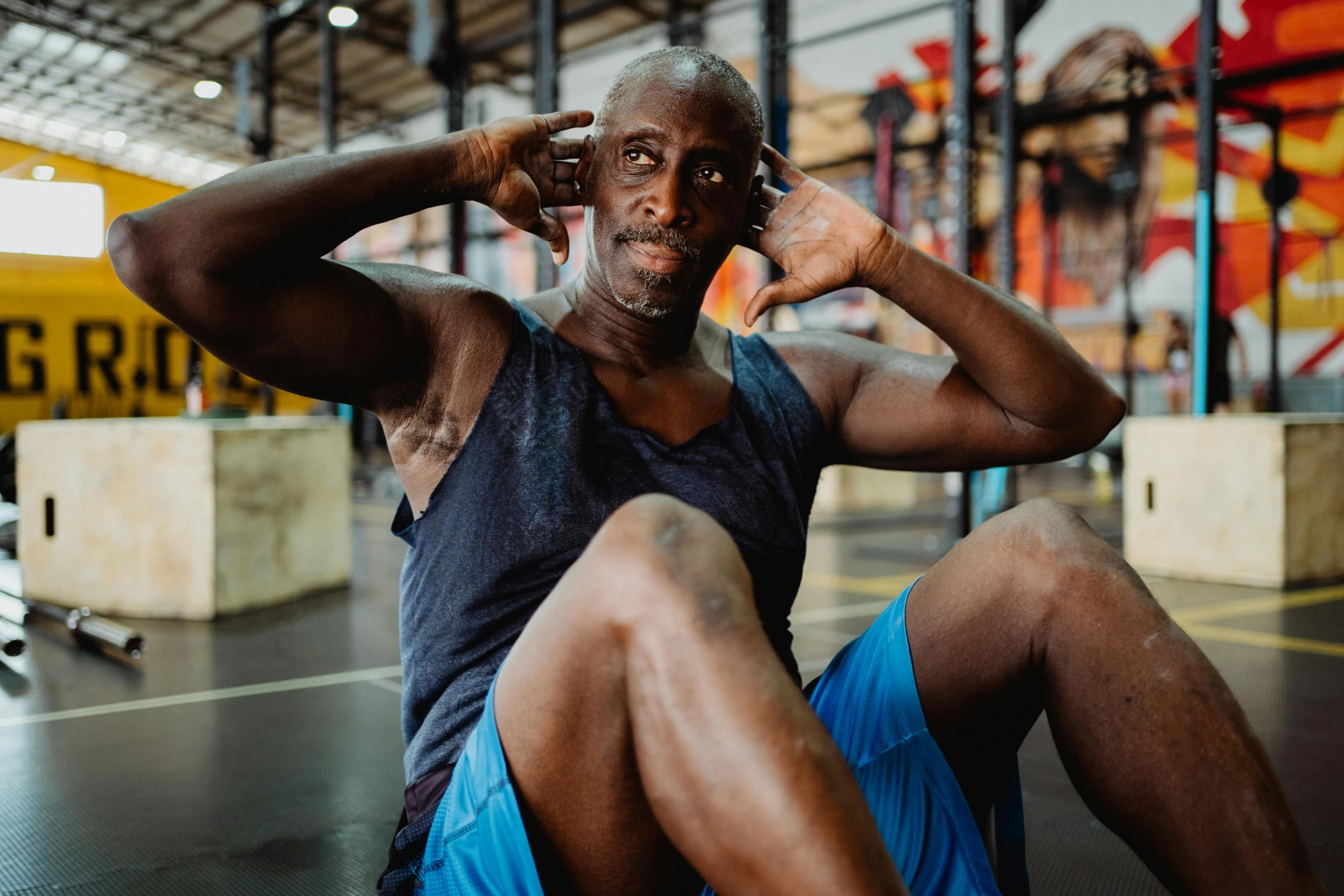 a man sitting on the ground talking on a cell phone, a portrait, pexels contest winner, hyperrealism, background a gym, lance reddick, thumbnail, background image