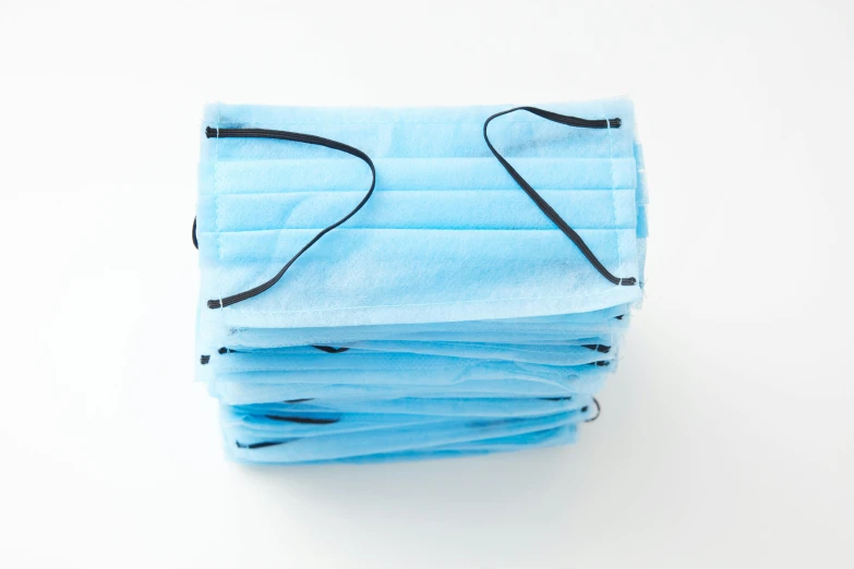 a stack of surgical masks on a white background, reddit, rectangular, light blue, thumbnail, low detail