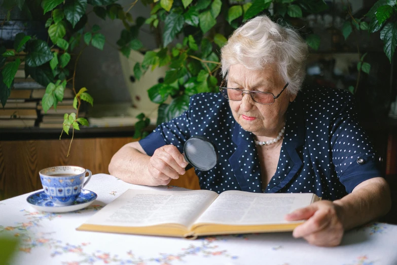 a woman sitting at a table looking through a magnifying glass, by Hazel Armour, pexels contest winner, an elderly, reading a book, 15081959 21121991 01012000 4k, multi-part