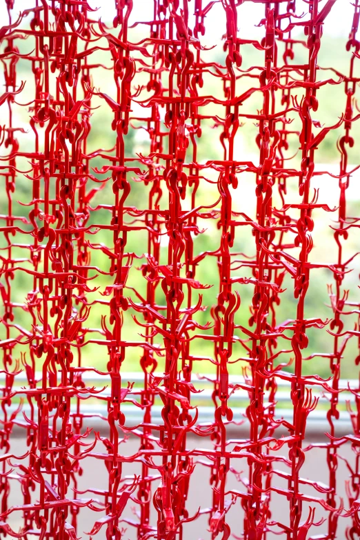 a red curtain hanging in front of a window, inspired by Chiharu Shiota, flickr, made of paperclips, closeup!!, made of lollypops, wheres wally