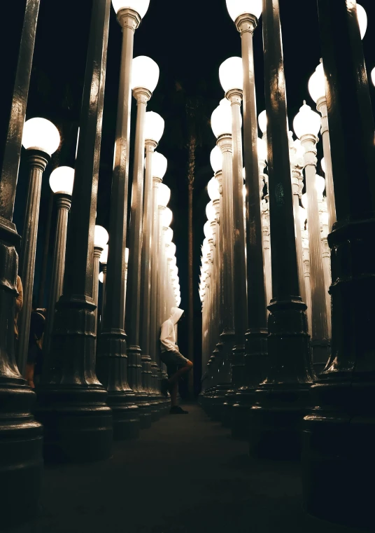 a row of street lights sitting next to each other, unsplash contest winner, visual art, giant columns palace, !dream los angeles, model, 4k museum photograph