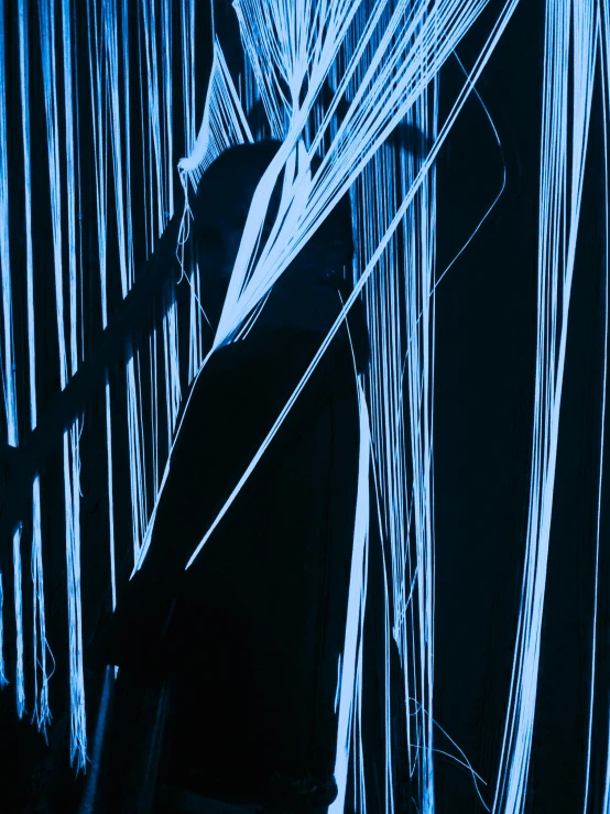 a man that is standing in the dark, inspired by Hans Hartung, unsplash, lyrical abstraction, ((blue)), laser show, yohji yamamoto, strings