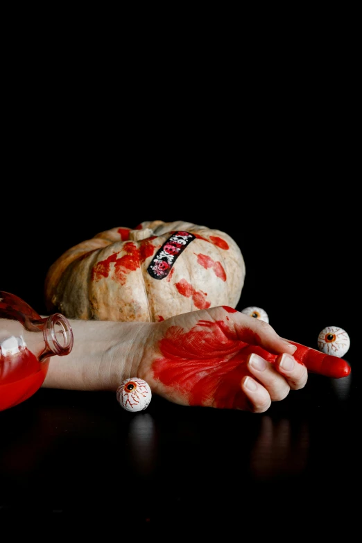 a close up of a person's hand with blood on it, a still life, by artist, pumpkins, pills, holding maracas, trending photo